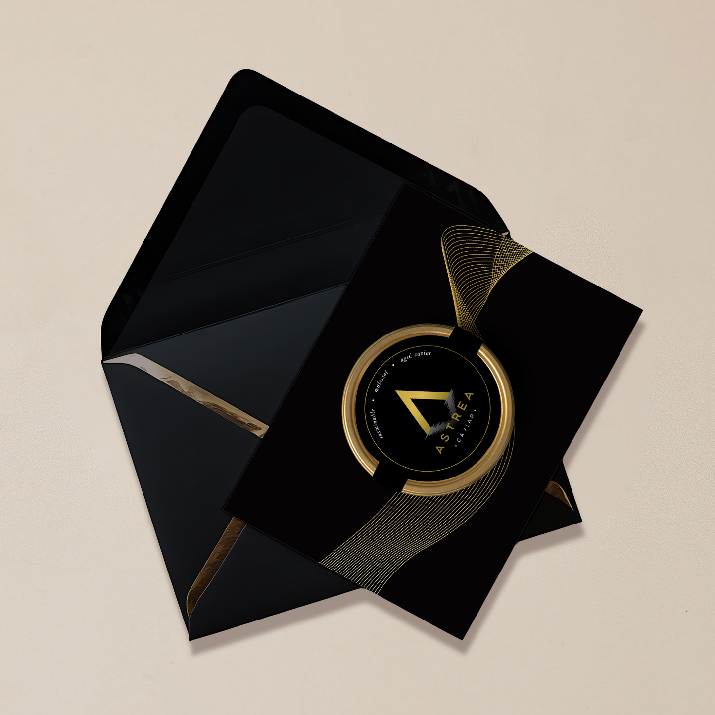 a black envelope with a black and gold greeting card by Astrea Caviar